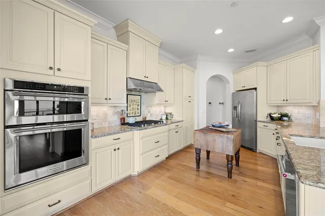 a bedroom with a bed window and table