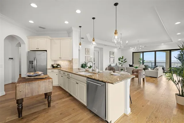 a spacious bathroom with a granite countertop sink mirror and shower