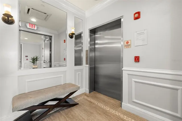 a living room with furniture or wooden floor and a chandelier