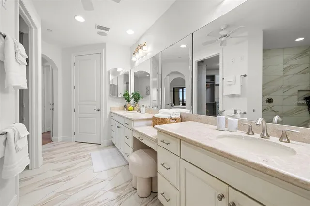 a front view of multi story residential apartment building with yard and sign board