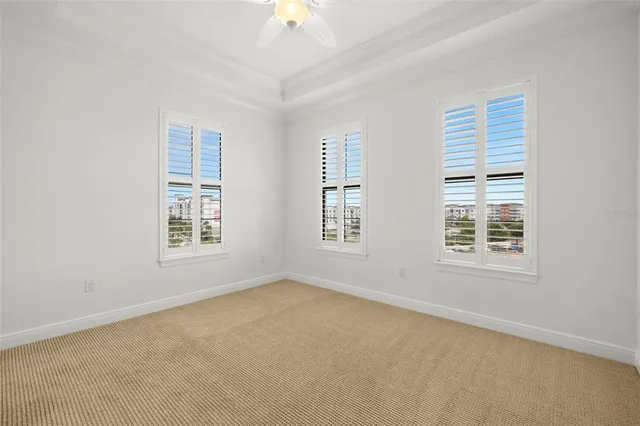 a view of a living room and a livingroom with furniture wooden floor chandelier
