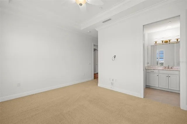 a dining hall with stainless steel appliances granite countertop a dining table and chairs