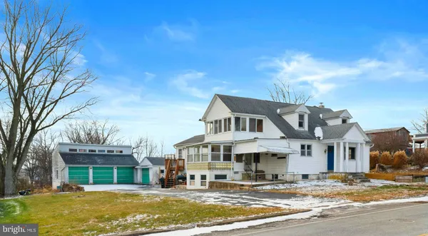 a front view of a house with a ocean view