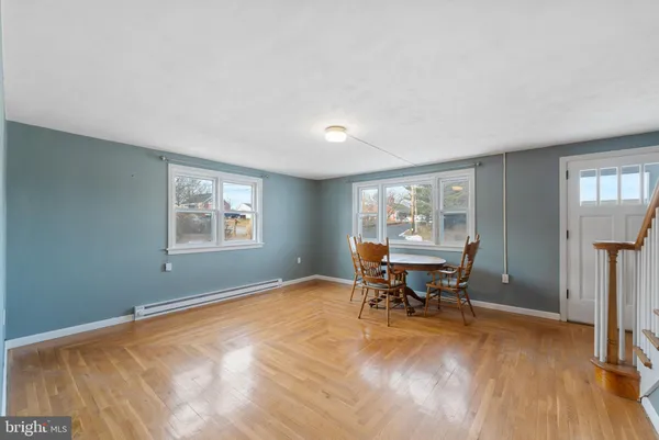 a view of a livingroom with furniture and a window