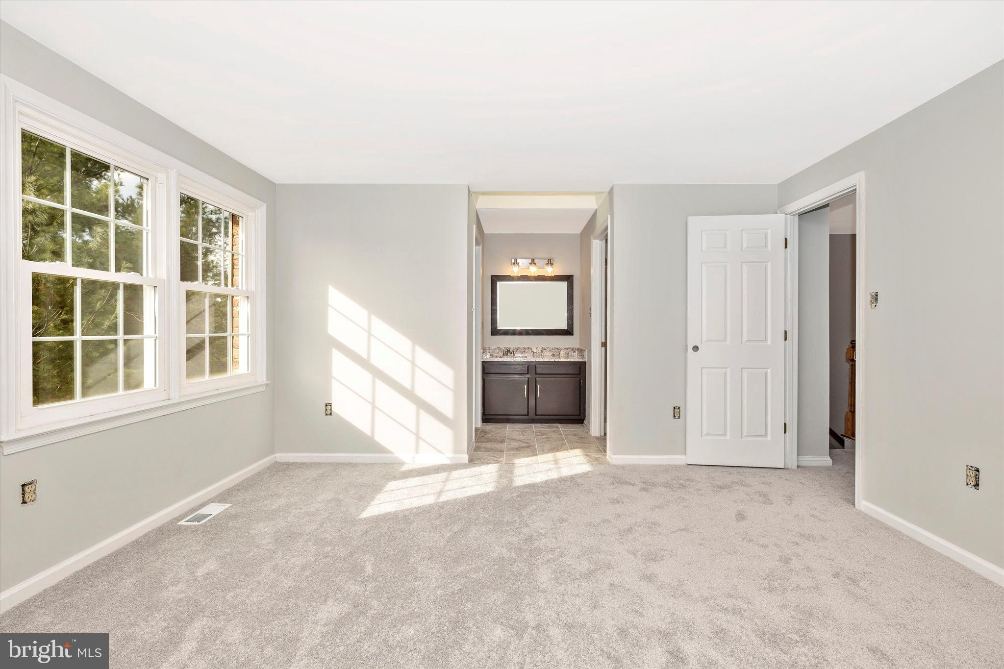 8001 Hollow Reed Court Frederick, MD 21701 - Photo 19 of 33 an empty room with windows and cabinet