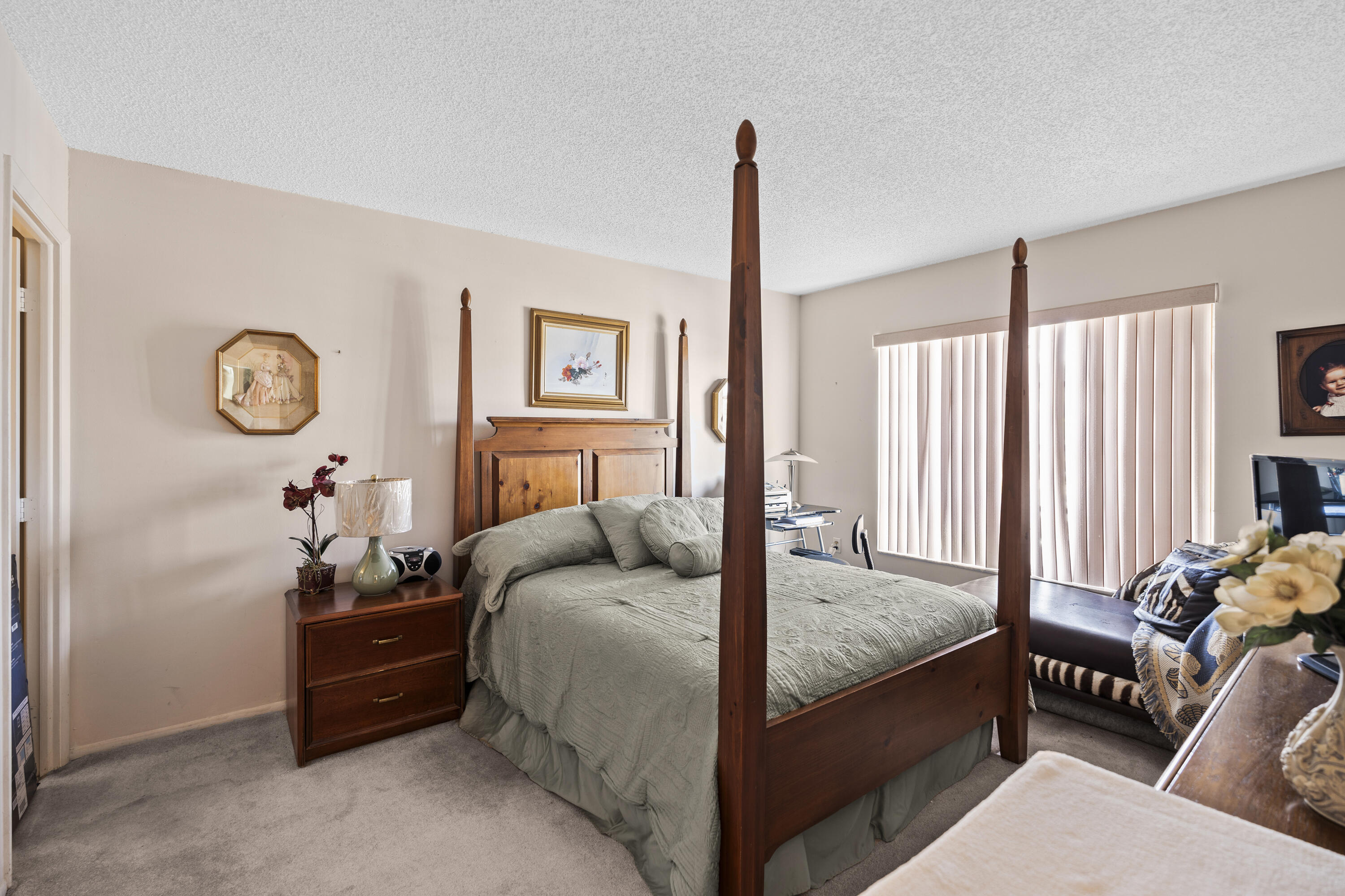 4174 Inverrary Drive, Unit 413 Lauderhill, FL 33319 - Photo 11 of 20 a bedroom with a bed and a closet