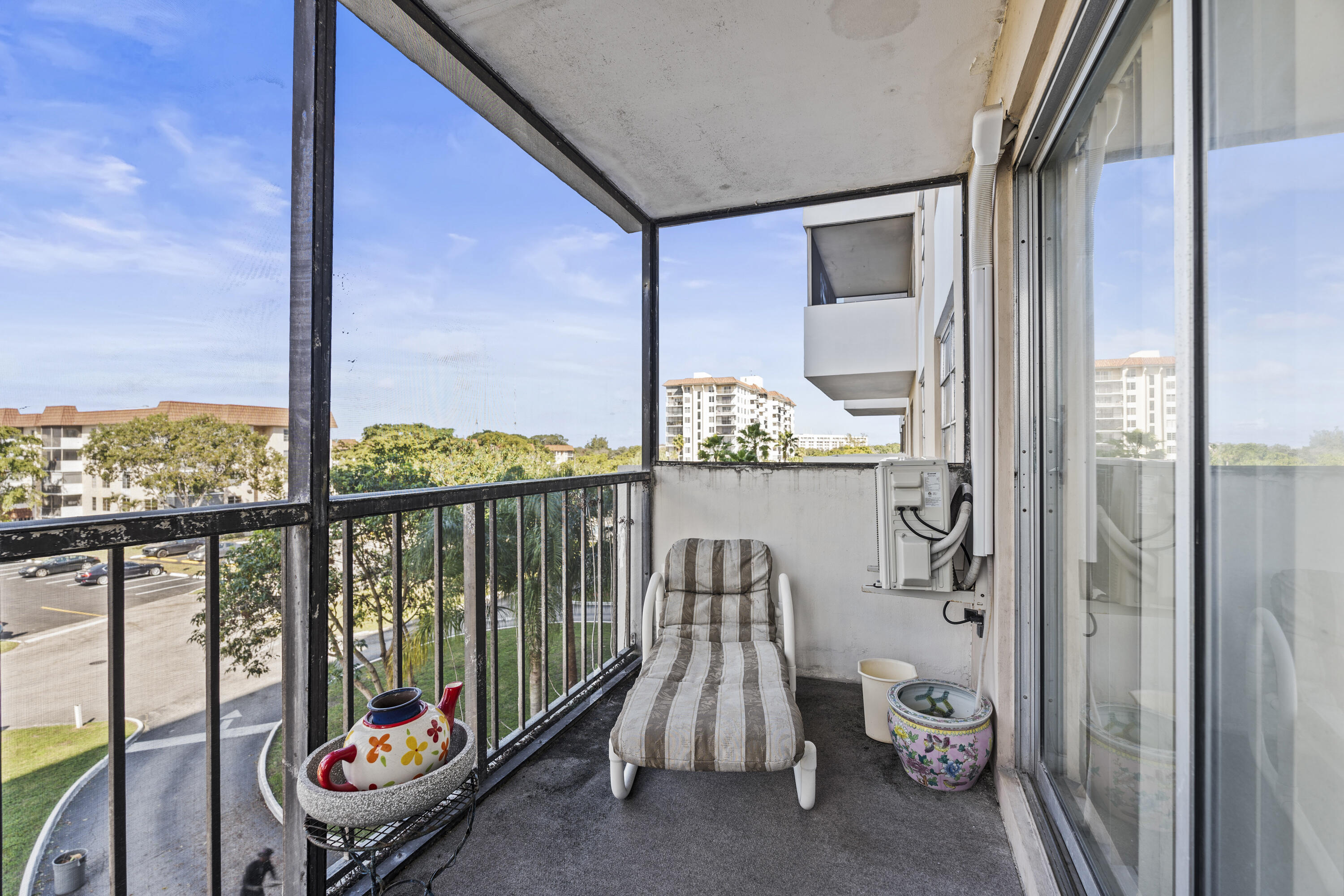 4174 Inverrary Drive, Unit 413 Lauderhill, FL 33319 - Photo 19 of 20 a balcony with furniture and window