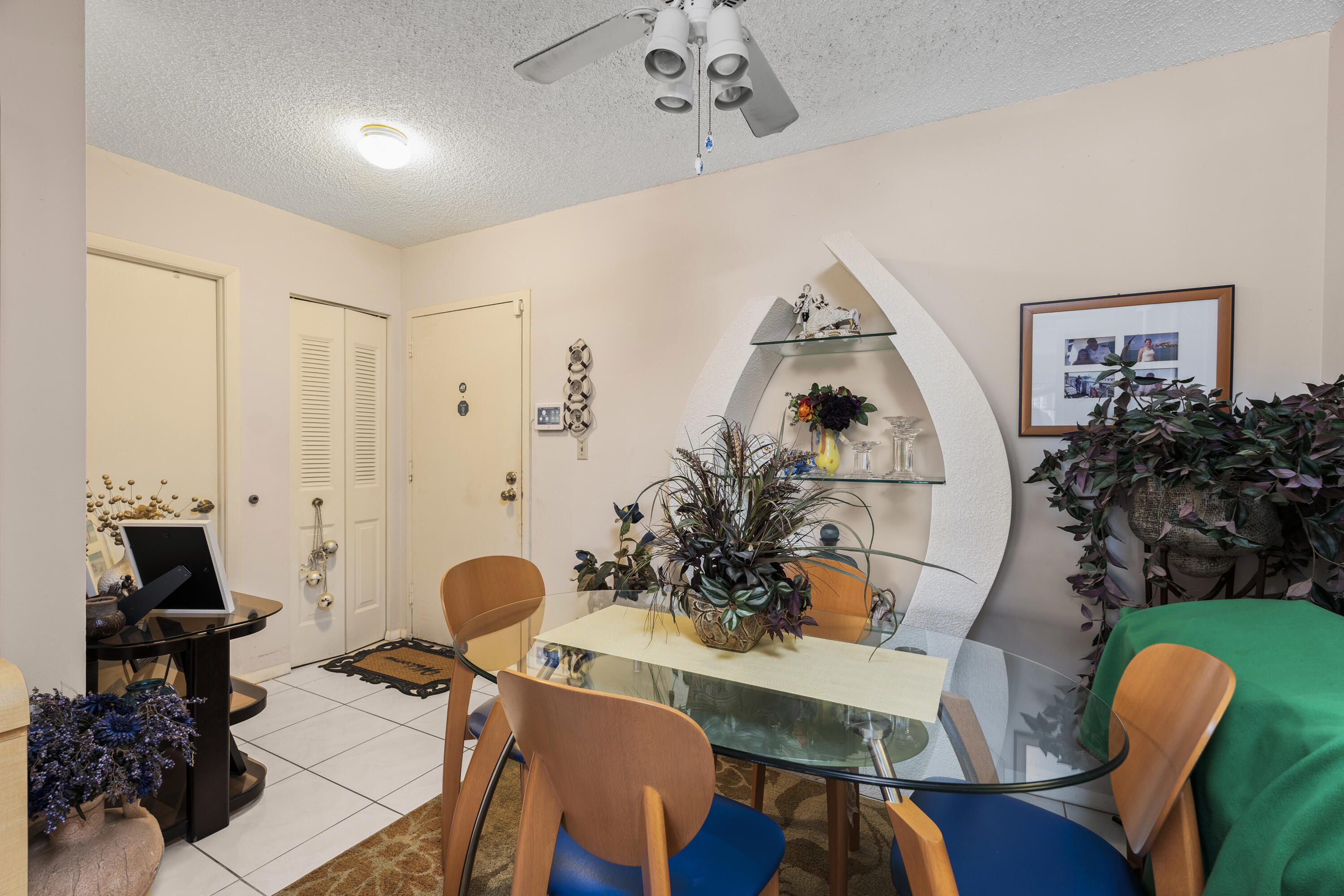 4174 Inverrary Drive, Unit 413 Lauderhill, FL 33319 - Photo 5 of 20 a living room with furniture and a chandelier