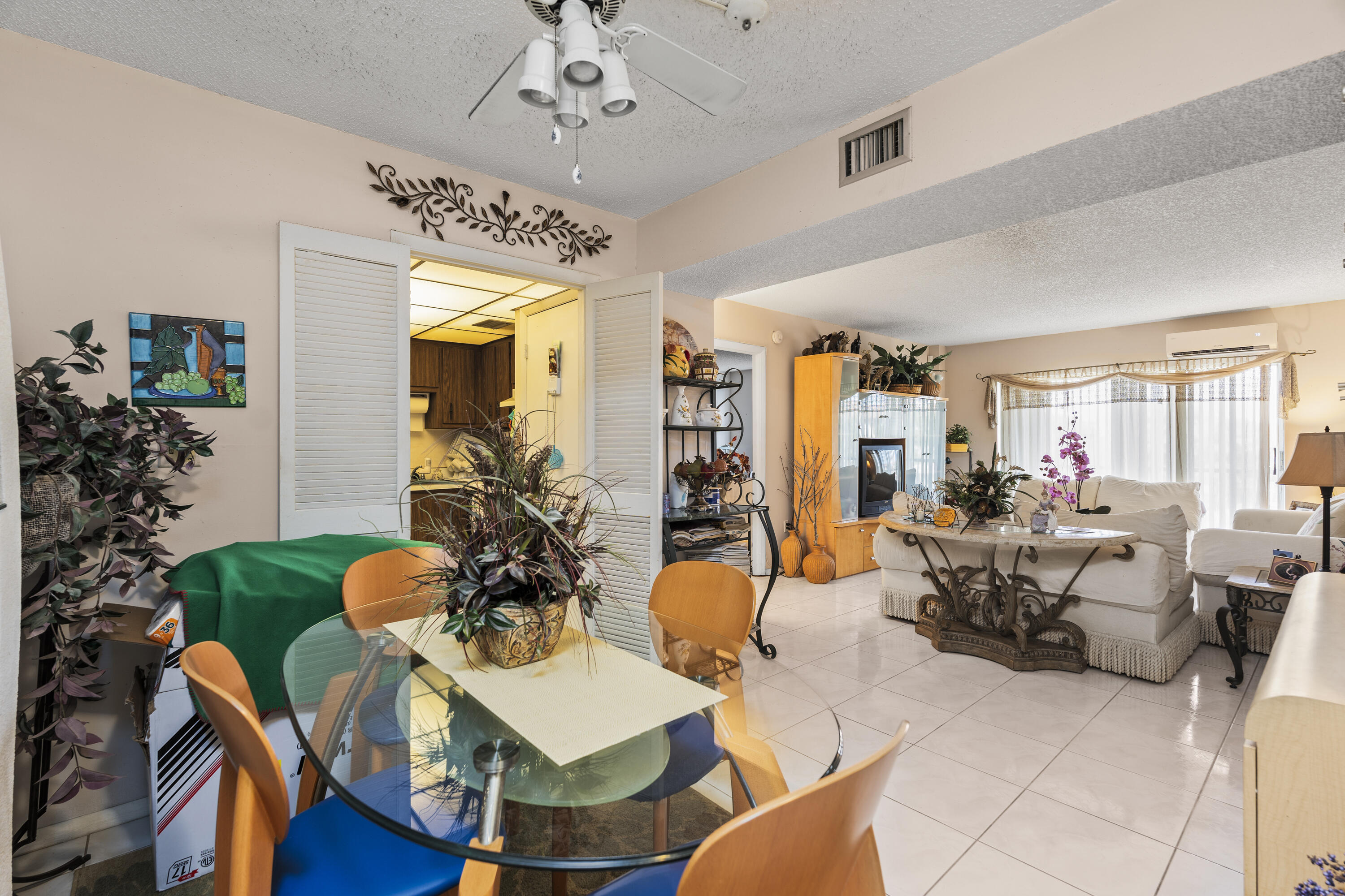 4174 Inverrary Drive, Unit 413 Lauderhill, FL 33319 - Photo 6 of 20 a view of a dining room with furniture window and wooden floor