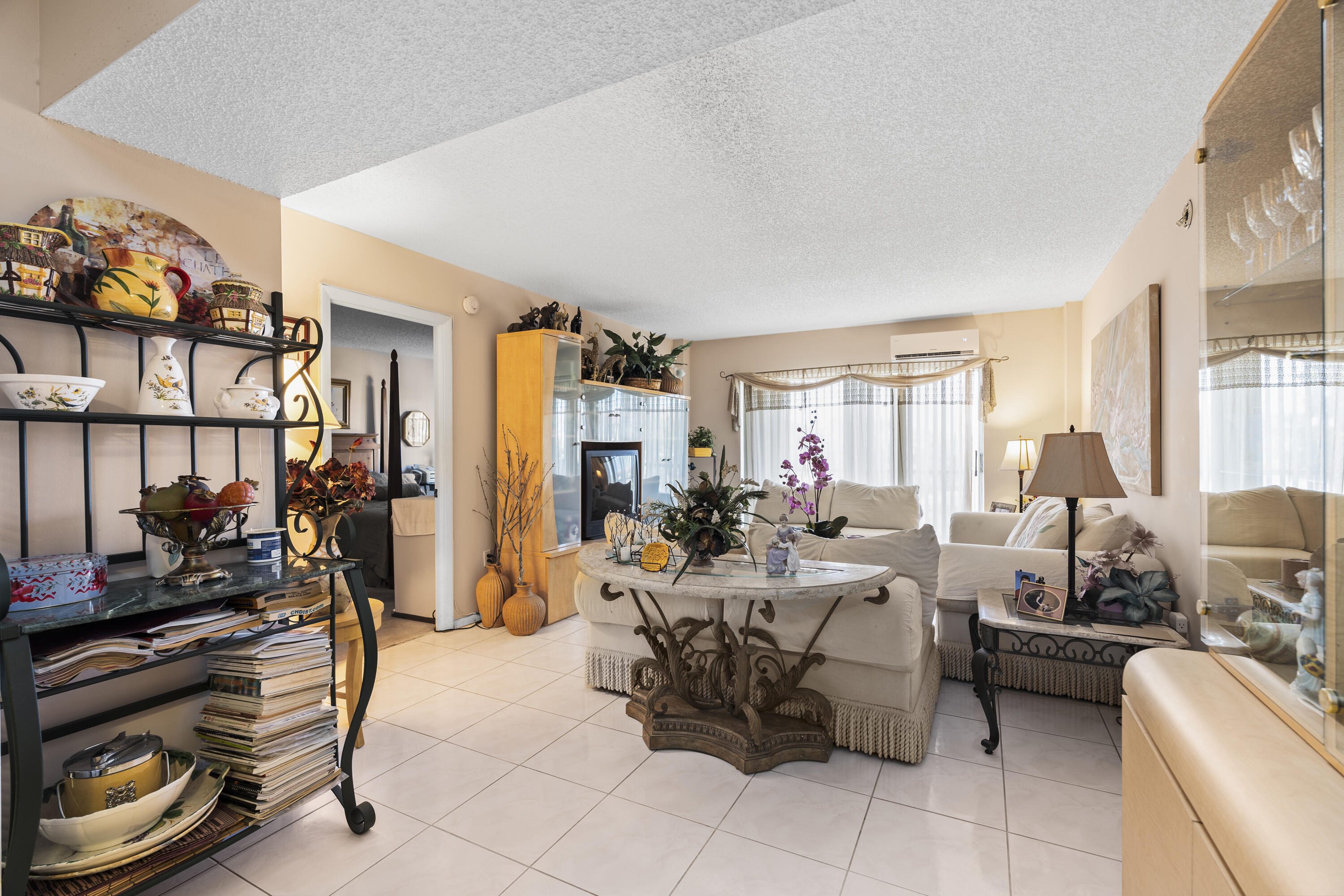 4174 Inverrary Drive, Unit 413 Lauderhill, FL 33319 - Photo 7 of 20 a living room with furniture and a window