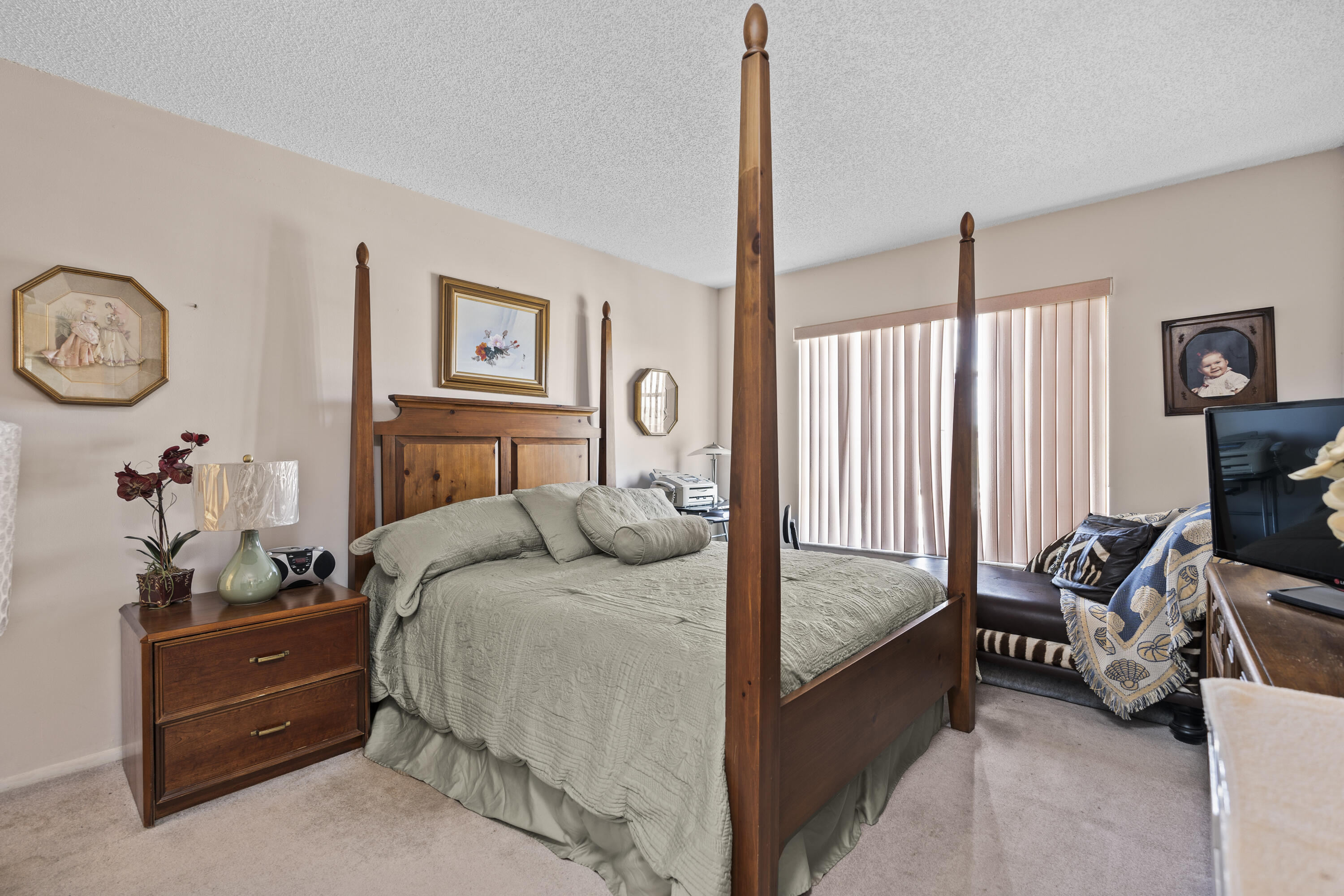 4174 Inverrary Drive, Unit 413 Lauderhill, FL 33319 - Photo 10 of 20 a bed room with a bed and a chair