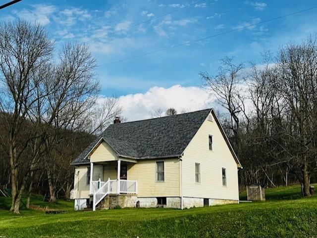 2440 Race Track Road Youngwood, PA 15697 - Photo 1 of 29 a view of a white house with a yard
