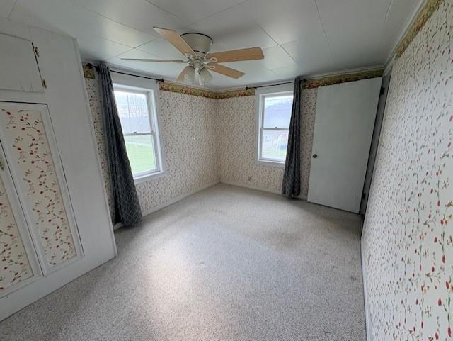2440 Race Track Road Youngwood, PA 15697 - Photo 16 of 29 an empty room with windows and fan