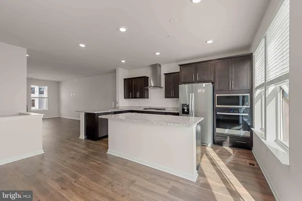 a kitchen with a refrigerator a sink and dishwasher
