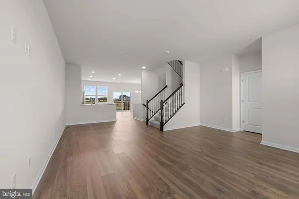 a view of entryway with wooden floor
