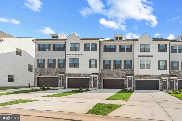 a front view of building with yard