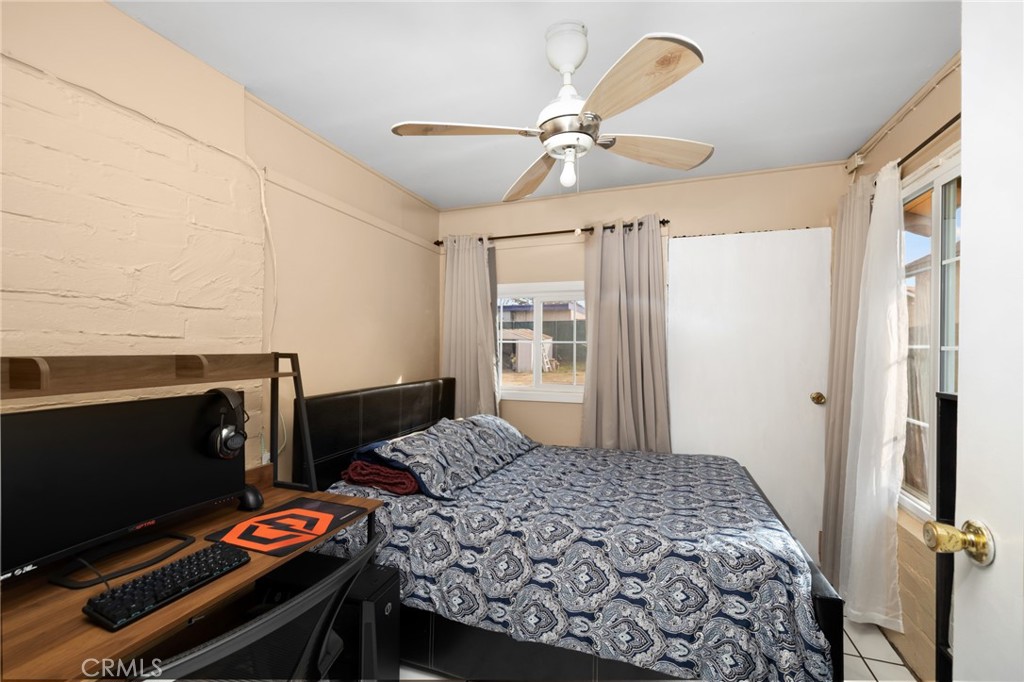 1816 Main Street Riverside, CA 92501 - Photo 14 of 34 a bedroom with a bed and a window