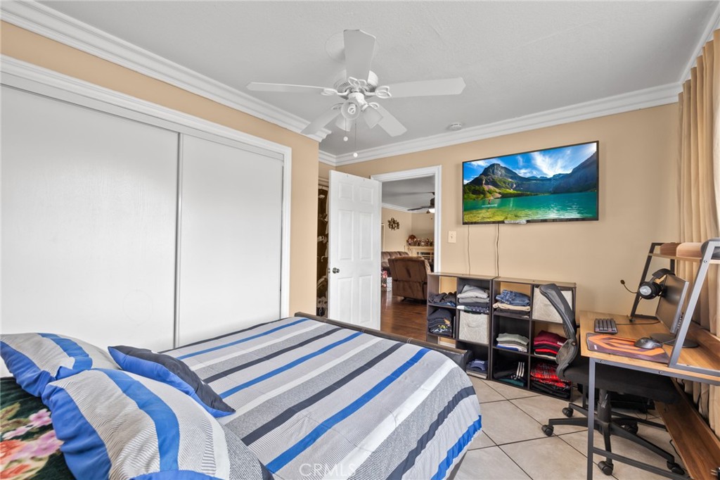 1816 Main Street Riverside, CA 92501 - Photo 19 of 34 a bedroom with a bed and a chandelier