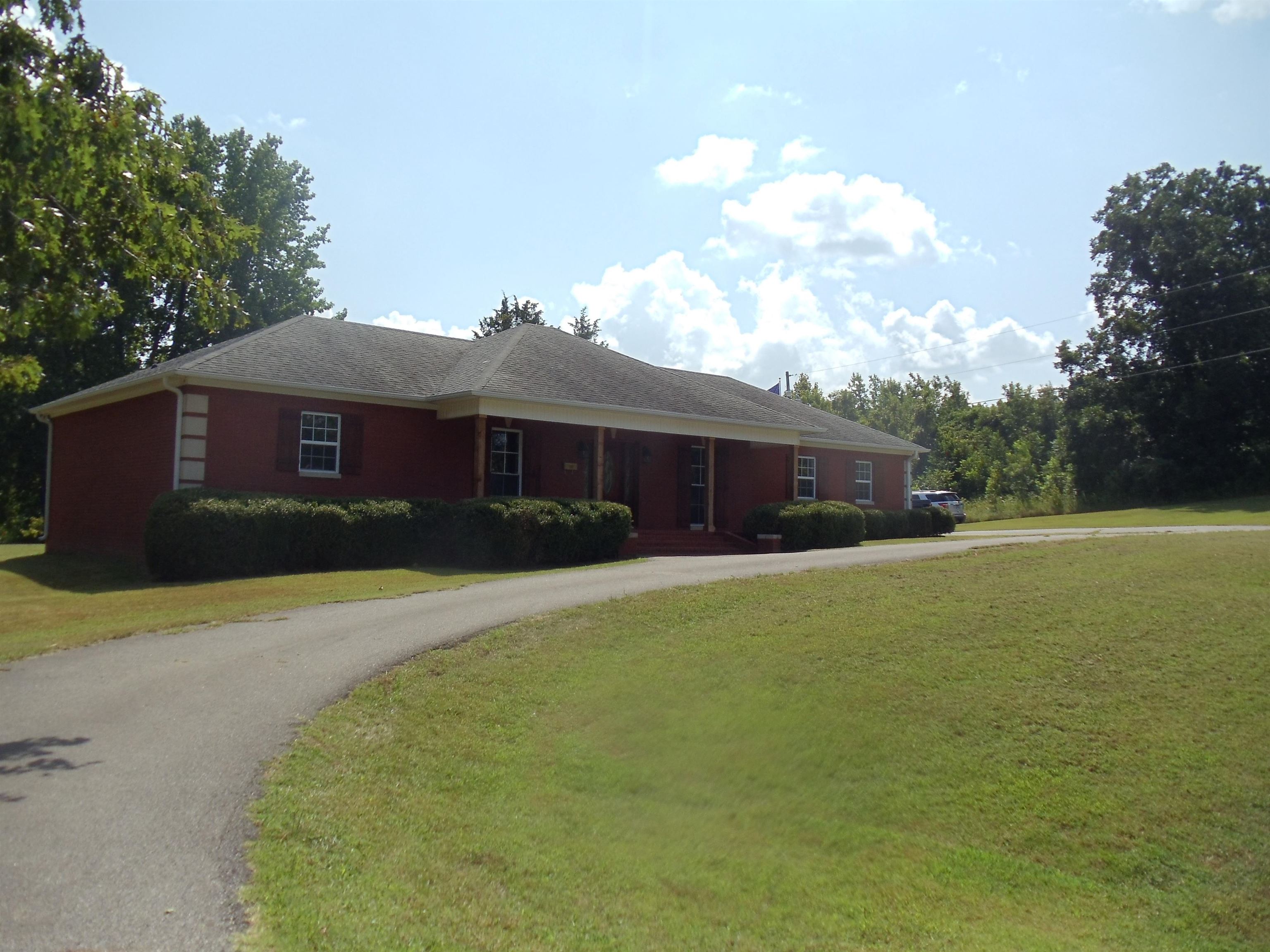 2695 Central Curve Road Ripley, TN 38063 - Photo 1 of 32 a front view of a house with a garden