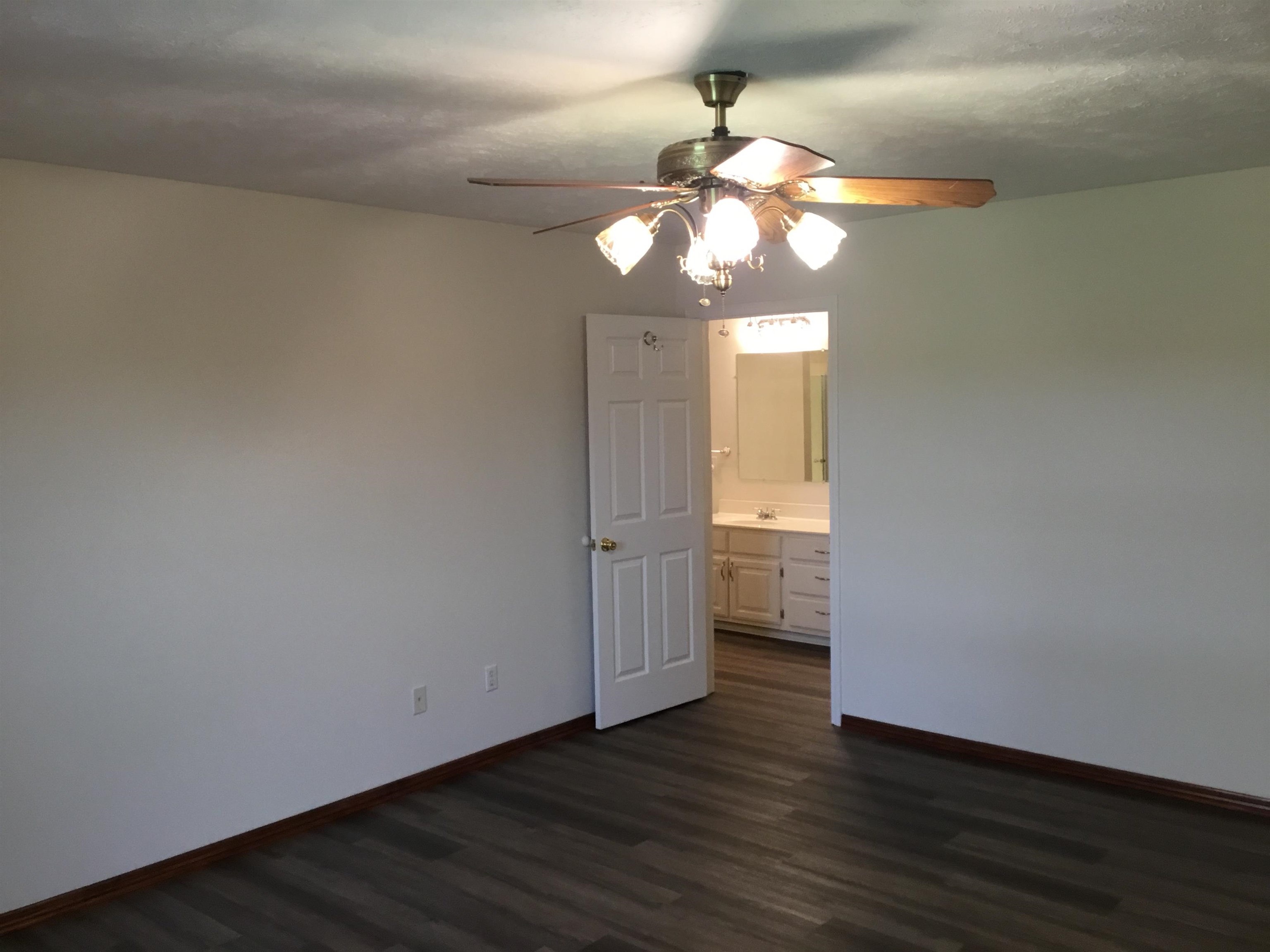 2695 Central Curve Road Ripley, TN 38063 - Photo 17 of 32 a view of an empty room with wooden floor and a window