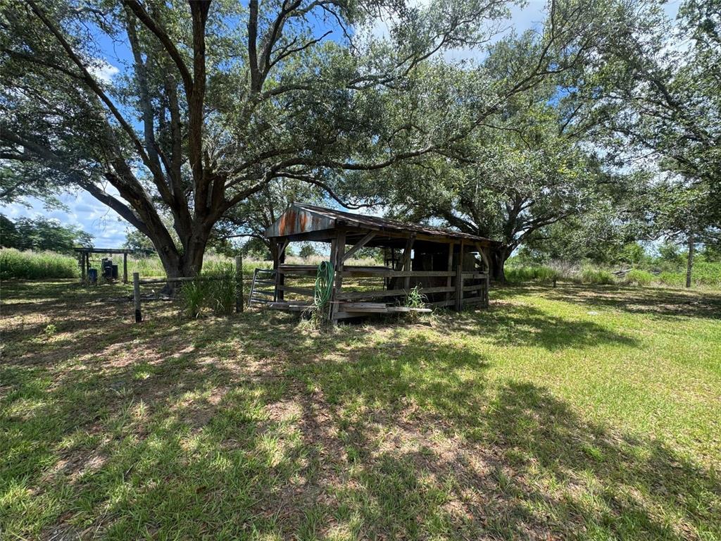 9827 Southeast Hoth Road Arcadia, FL 34266 - Photo 10 of 28 a front view of a house with a yard