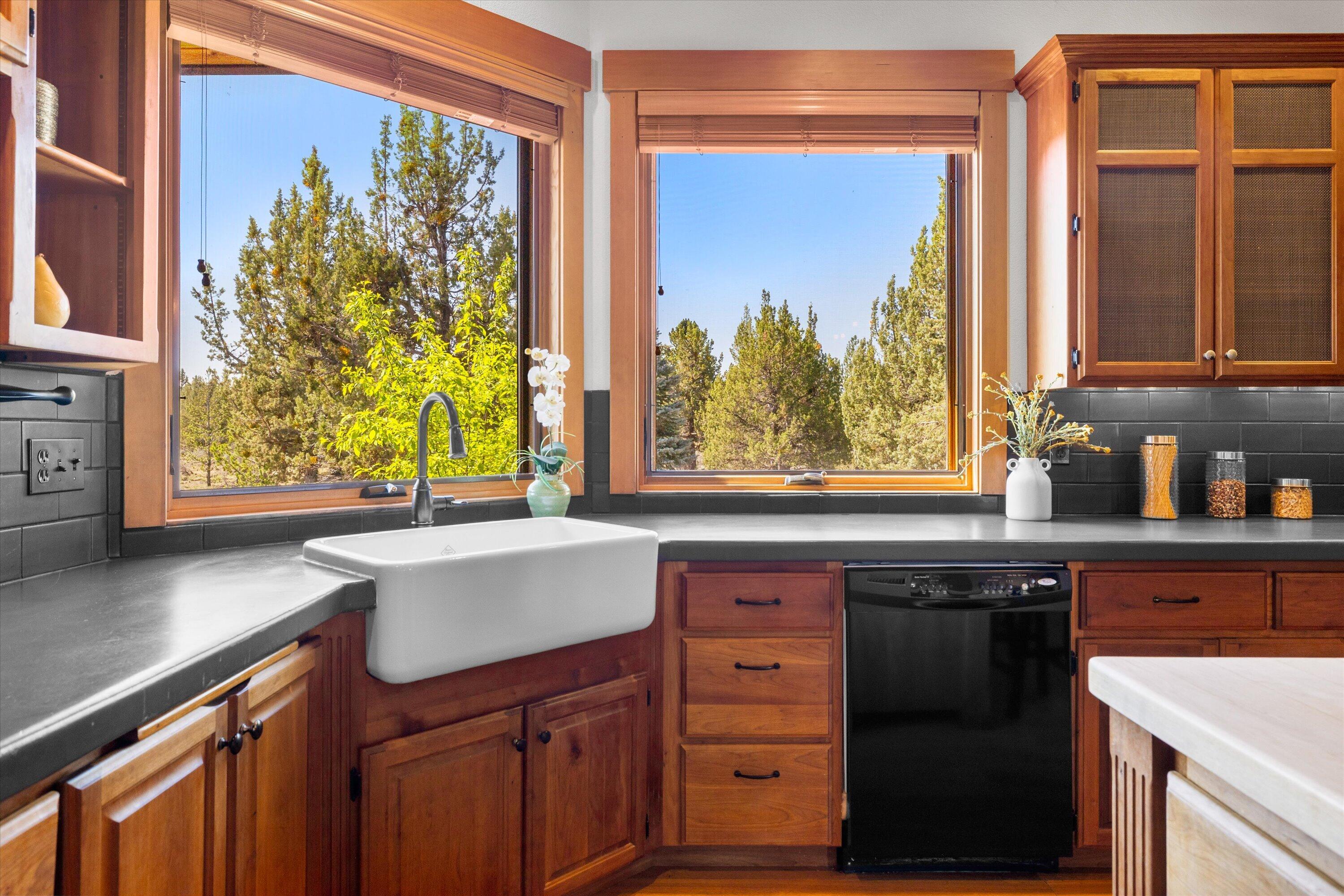 64155 Hunnell Road Bend, OR 97703 - Photo 24 of 96 Function with beauty. A kitchen window that overlooks the pond.