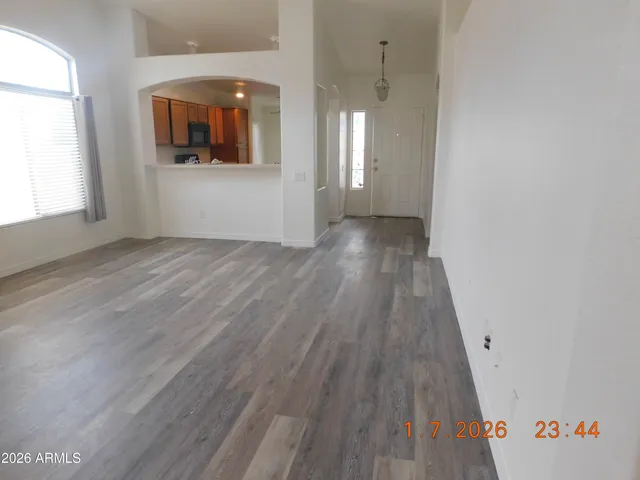 a view of hallway with wooden floor