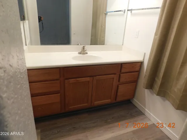 a bathroom with a sink and a mirror