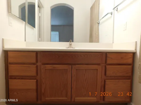 a bathroom with a sink and a mirror