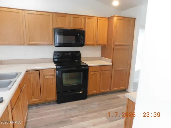 a kitchen with a stove and a microwave