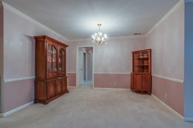 977 Gen George Patton Road Nashville, TN 37221 - Photo 5 of 18 Formal dining room with chair rail and crown molding