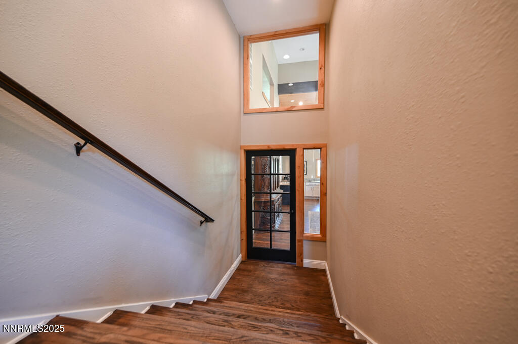 1147 Autumn Hills Road Gardnerville, NV 89460 - Photo 10 of 53 a view of a hallway with wooden floor and staircase