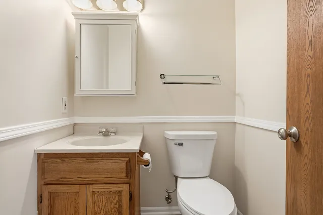 a view of a room with a ceiling fan and a fan