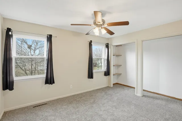 a view of room with hardwood floor and window