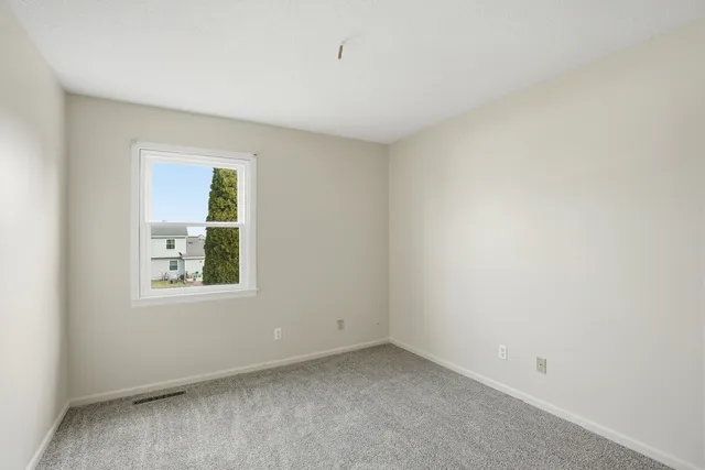 a bathroom with a sink a toilet a mirror a vanity and bathtub