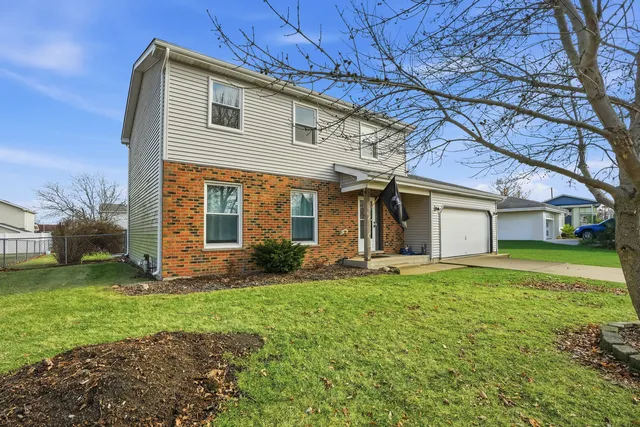 an aerial view of a house with garden space and houses