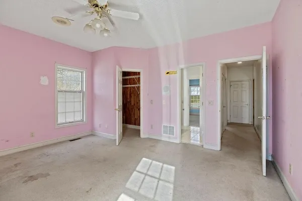 a kitchen with stainless steel appliances granite countertop a sink counter space cabinets and a large window