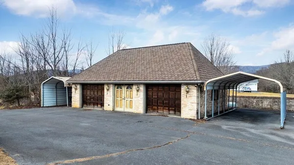a view of multiple houses with a yard