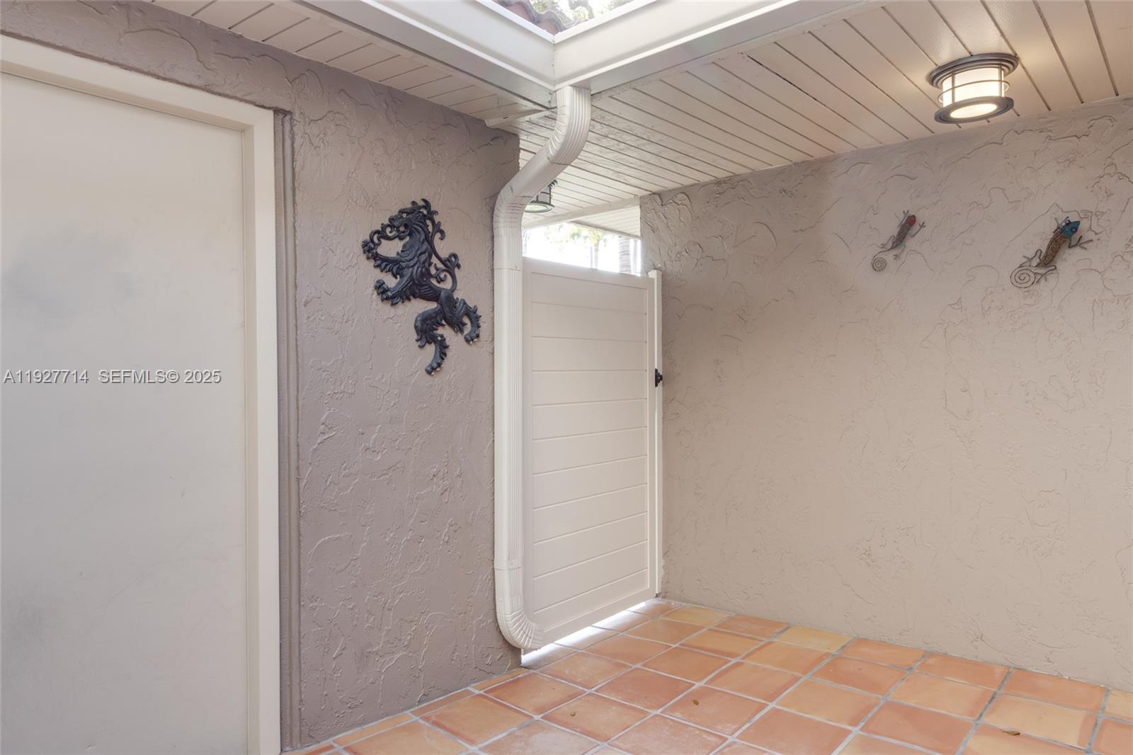 500 Bonnie Brae Way, Unit 17 Hollywood, FL 33021 - Photo 15 of 32 a view of a hallway with wooden floor and a bathroom