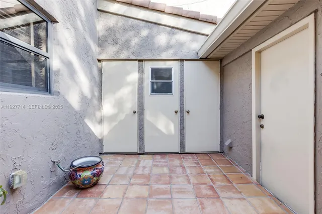 a front view of a house with parking space
