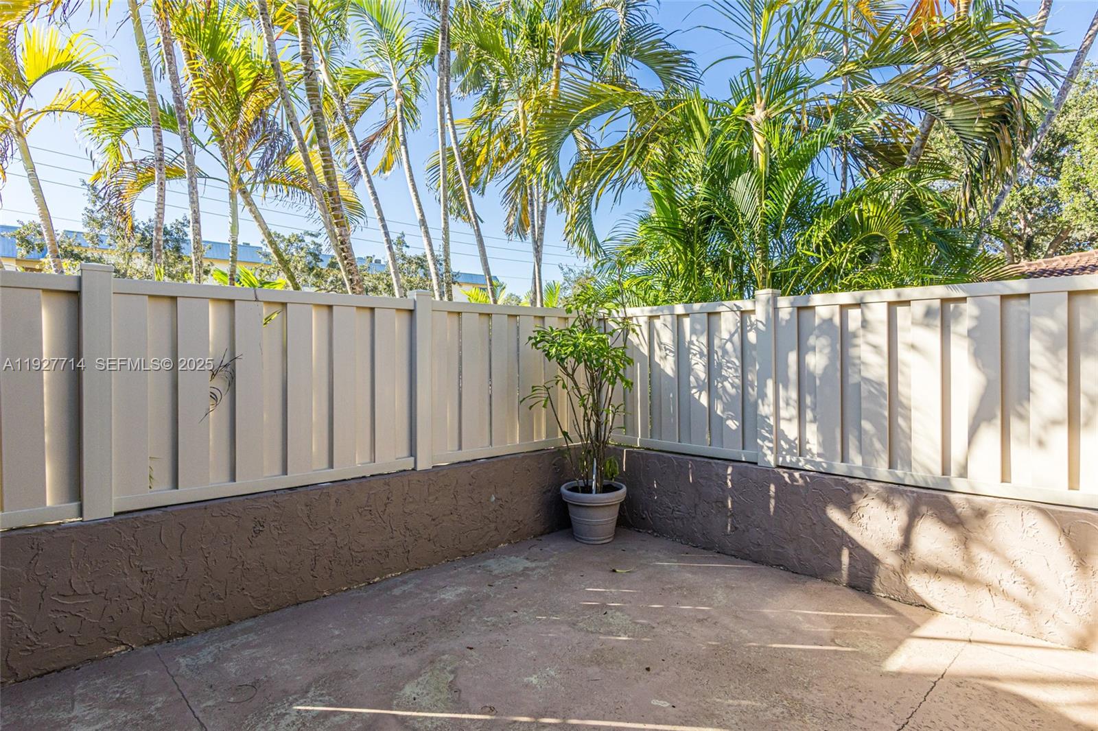 500 Bonnie Brae Way, Unit 17 Hollywood, FL 33021 - Photo 22 of 32 a wooden fence with trees in the background