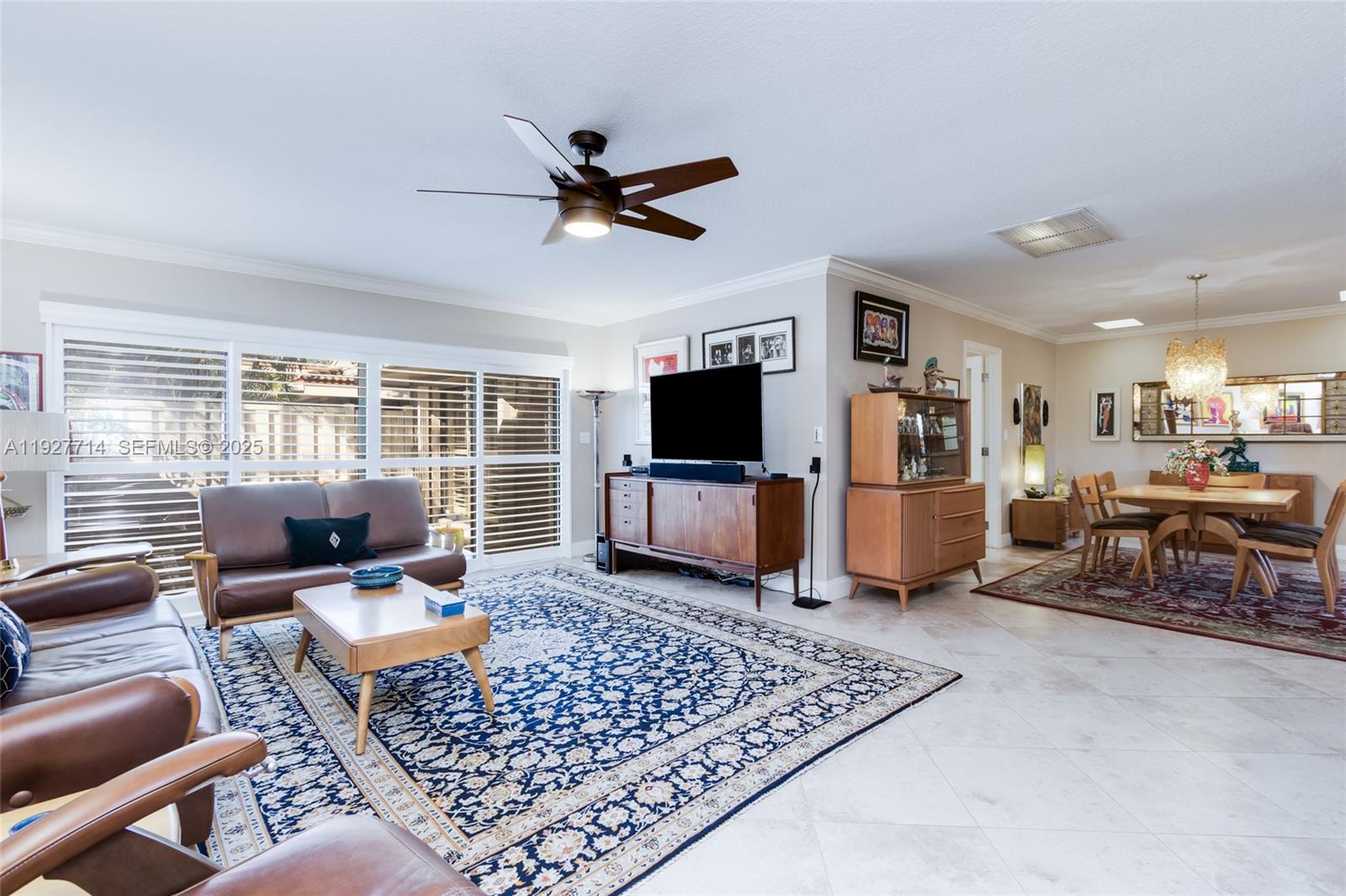 500 Bonnie Brae Way, Unit 17 Hollywood, FL 33021 - Photo 25 of 32 a living room with furniture and a flat screen tv