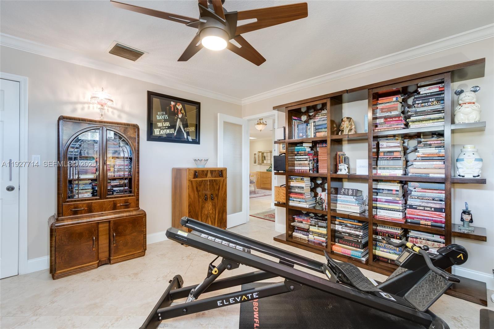 500 Bonnie Brae Way, Unit 17 Hollywood, FL 33021 - Photo 29 of 32 a room with gym equipment and a large window