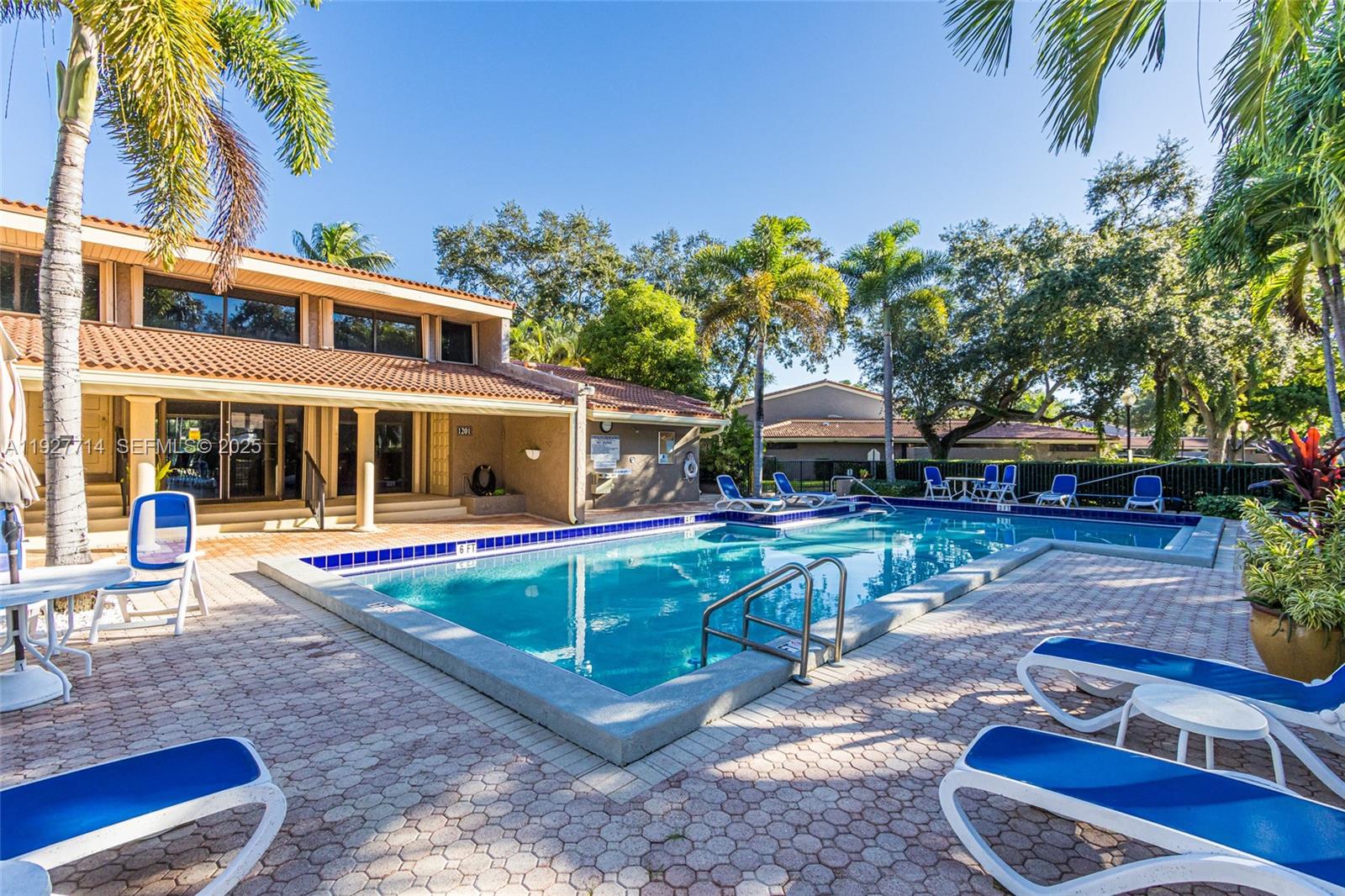 500 Bonnie Brae Way, Unit 17 Hollywood, FL 33021 - Photo 30 of 32 a view of a house with backyard swimming pool and sitting area