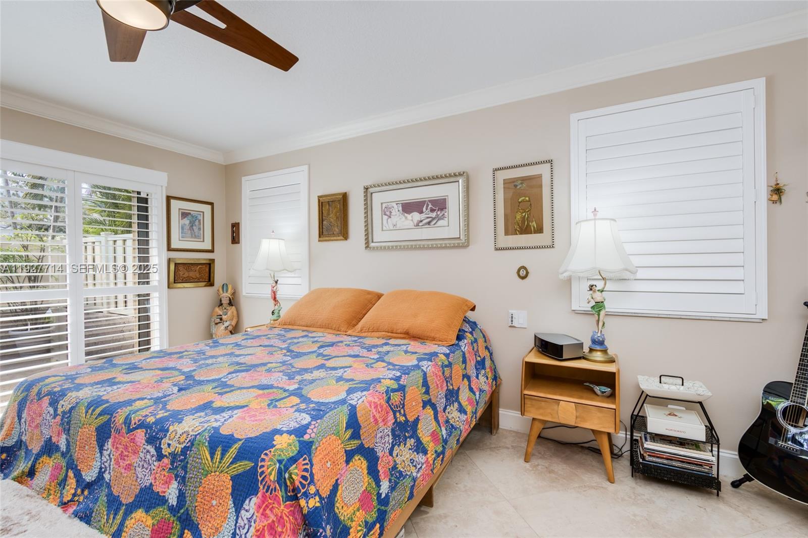 500 Bonnie Brae Way, Unit 17 Hollywood, FL 33021 - Photo 6 of 32 a bedroom with a bed and a chandelier