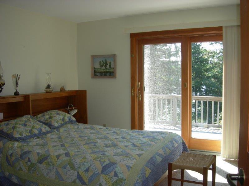 462 Gray Town Road Sedgwick, ME 04676 - Photo 13 of 32 First-floor master bedroom opening...