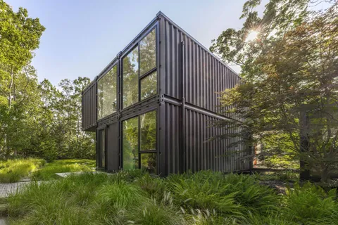 a view of a house with a small yard