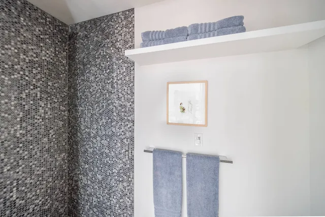 a bathroom with a shower curtain and a sink