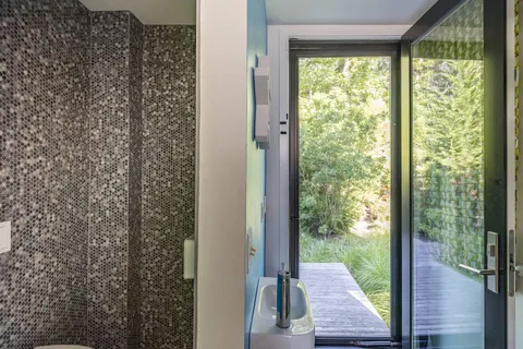 a view of a balcony with wooden floor