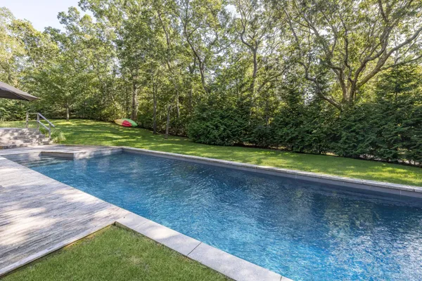 a view of a yard with a large trees